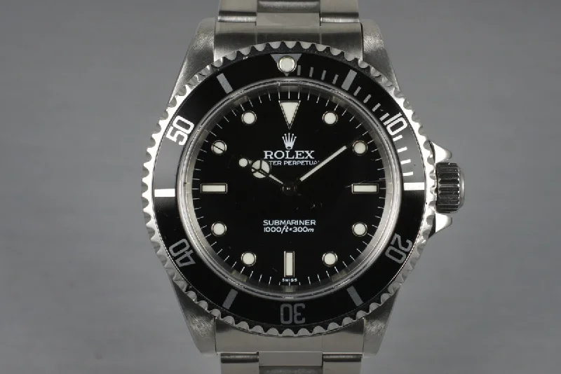 Men’s watches with leather straps and minimalist faces for a refined, modern appearance-1999 Rolex Submariner 14060 with Box and Papers