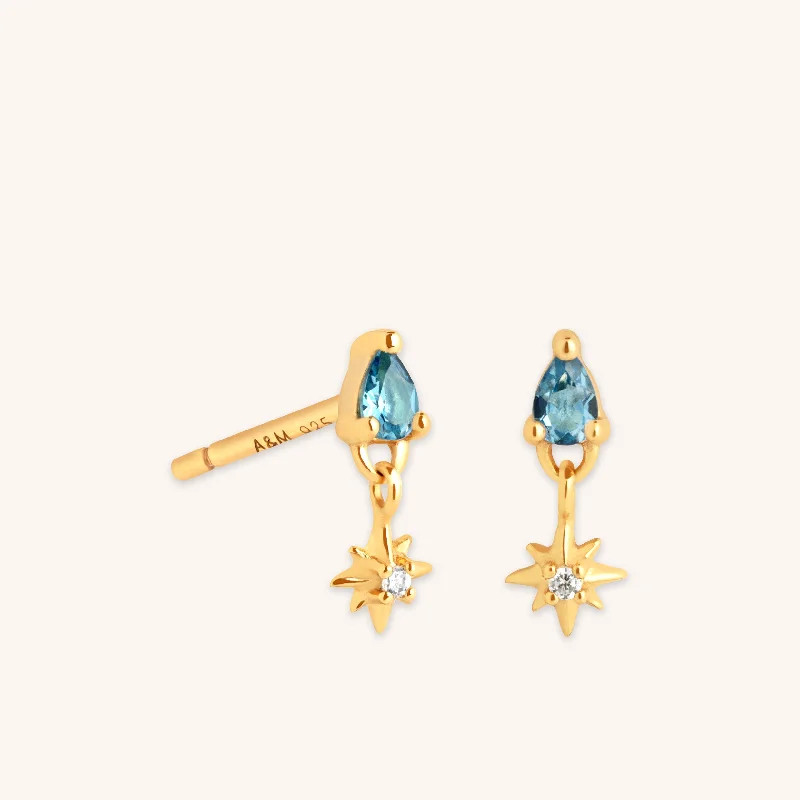 Hoop earrings with stacked layers for a bold and textured design-Blue Topaz Star Charm Studs in Gold