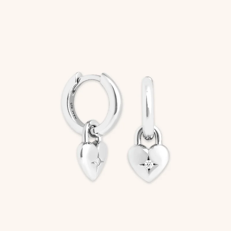 Best hoop earrings with satin ribbons for a soft, feminine appearance-Heart Charm Huggies in Silver